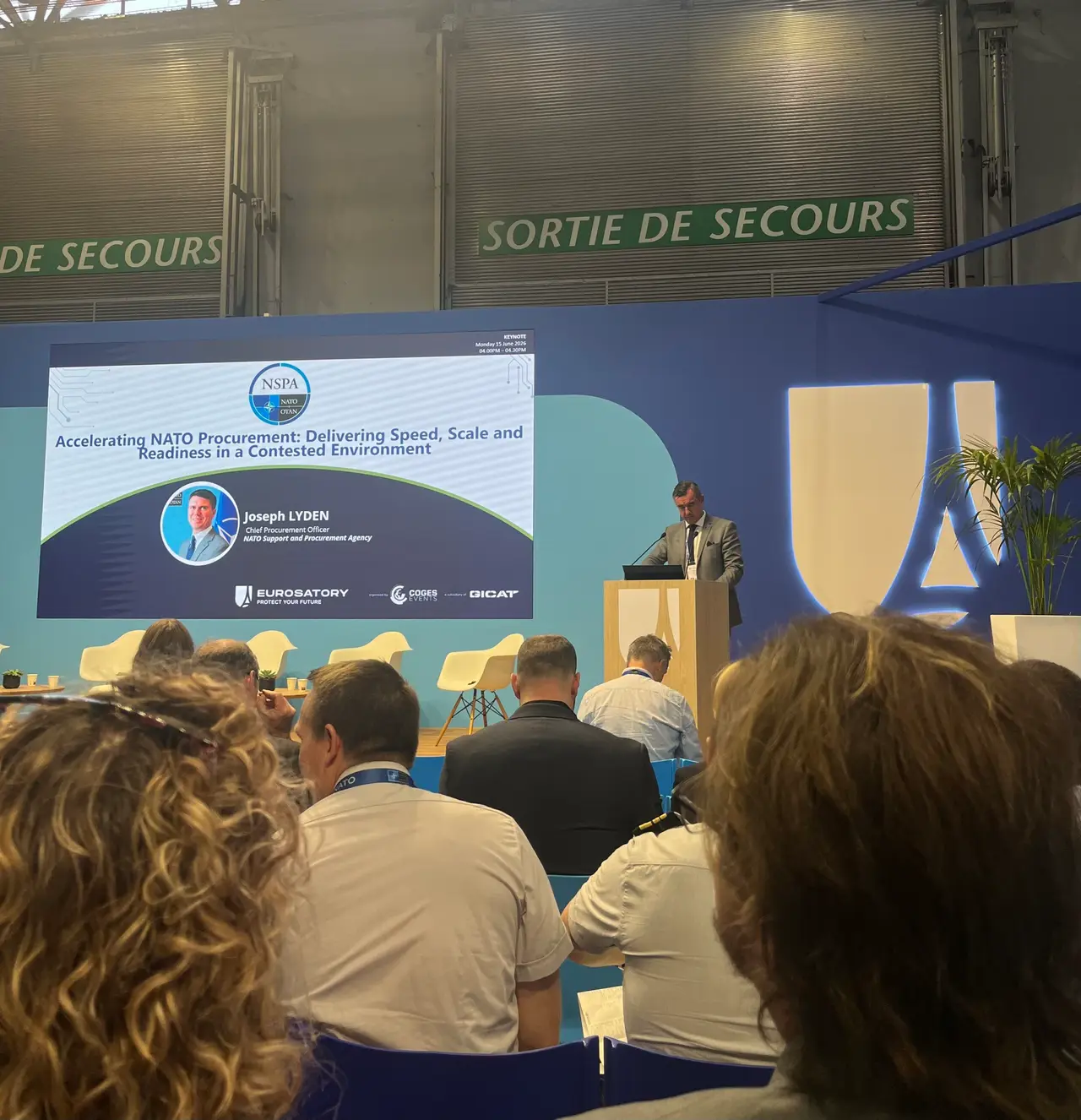 Talk by Joseph Lyden (NATO Support and Procurement Agency) about the acceleration of NATO procurement.