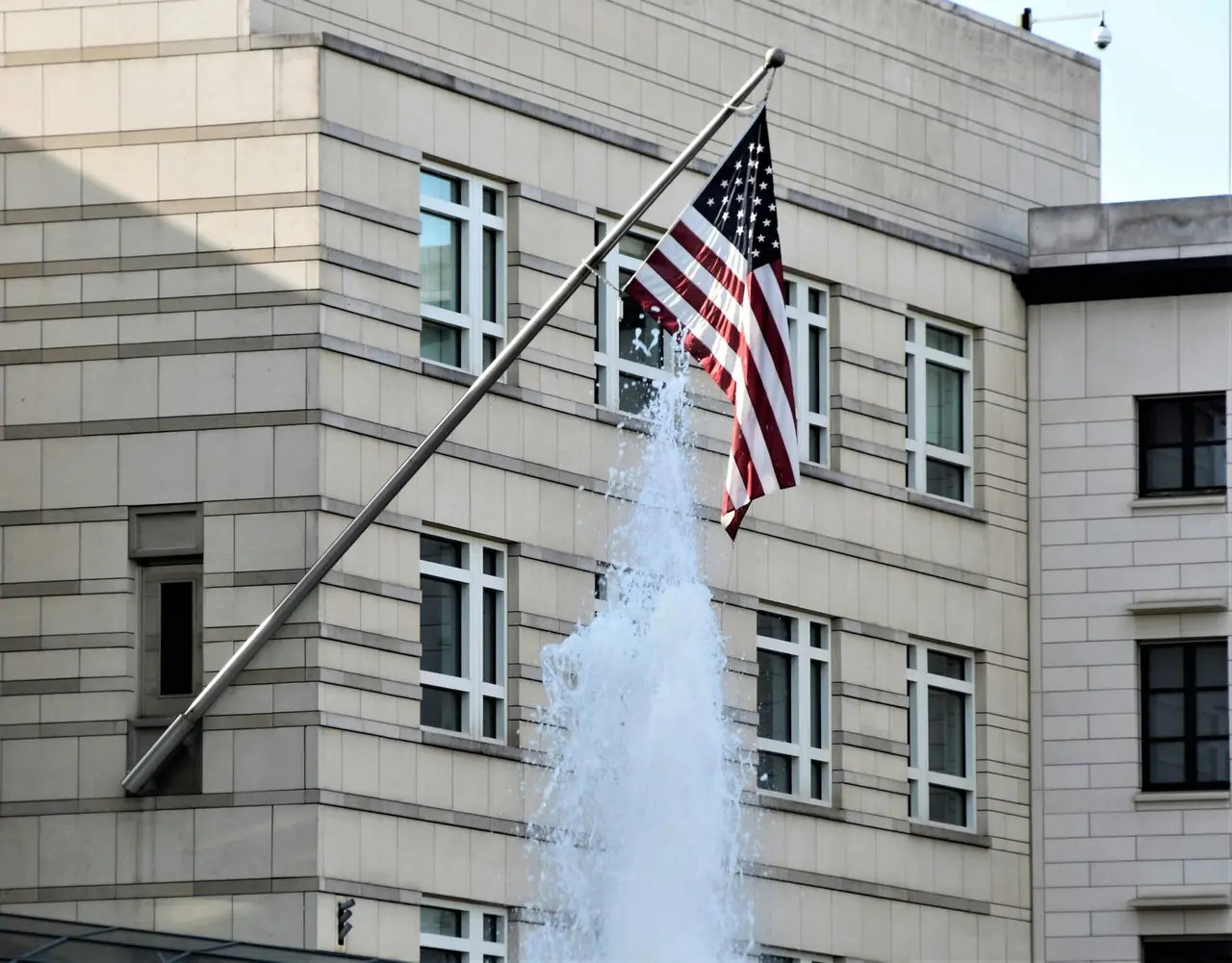Brown concrete building with water fountain